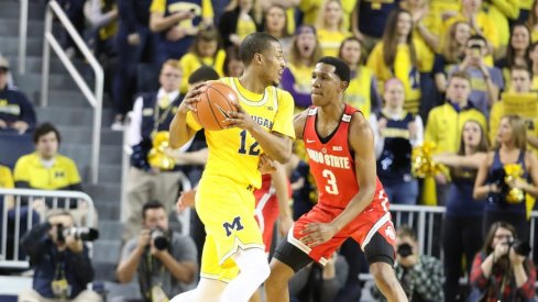 C.J. Jackson guards a Michigan player in the game on Saturday.