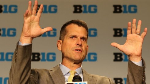 Jim Harbaugh delivers a press conference