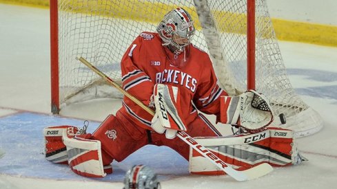 Matt Tomkins makes a save in the Buckeyes' NCAA opener against Minnesota-Duluth.