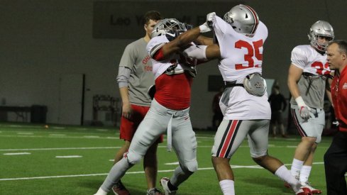 Chris Worley and Dante Booker go through drills.