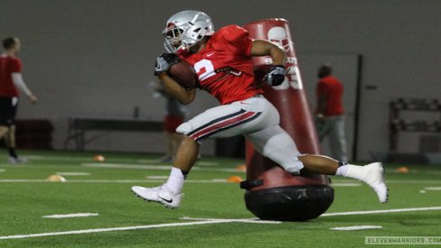 J.K. Dobbins passes Antonio Williams.