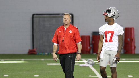 Ohio State LBs coach Bill Davis and Jerome Baker walk off the practice field.