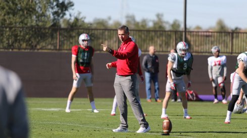 Urban Meyer coaches up his team during spring practices