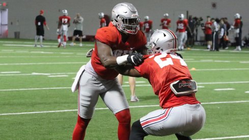 Ohio State tight ends A.J. Alexander and Kierre Hawkins work during a recent spring practice.