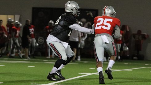 J.T. Barrett hands off to Mike Weber during spring practice. 