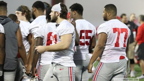Ohio State's defensive line gathers during a spring practice.