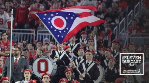 An Ohio State band member waves the Ohio state flag