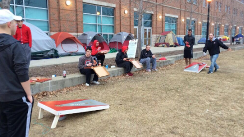Students playing cornhole in Mattaritaville
