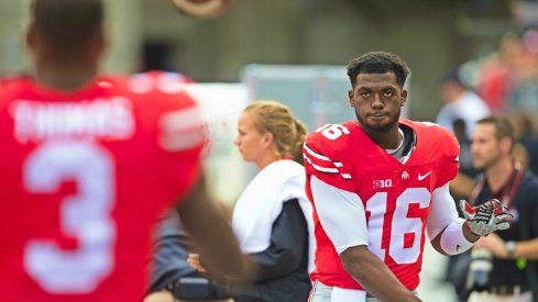 J.T. Barrett warms up with Michael Thomas, 2015