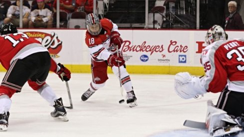Ohio State's Christian Lampasso locks sights on Rensselaer goalie Chase Perry.