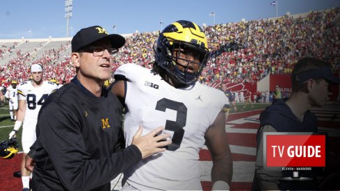 Oct 14, 2017; Bloomington, IN, USA; Michigan Wolverines coach Jim Harbaugh walks off the field with defensive lineman Rashan Gary (3) after the game against the Indiana Hoosiers at Memorial Stadium. Michigan defeats Indiana 27-20 in overtime. Mandatory Credit: Brian Spurlock-USA TODAY Sports
