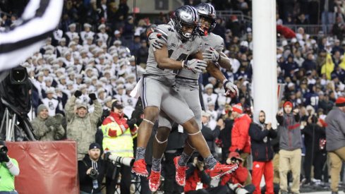 K.J. Hill and Johnnie Dixon celebrate one of the Buckeyes' three fourth-quarter touchdowns.