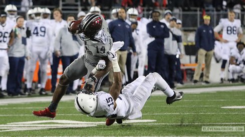 K.J. Hill punks a Penn State defensive back.