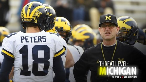 Michigan quarterback Brandon Peters and Michigan head coach Jim Harbaugh