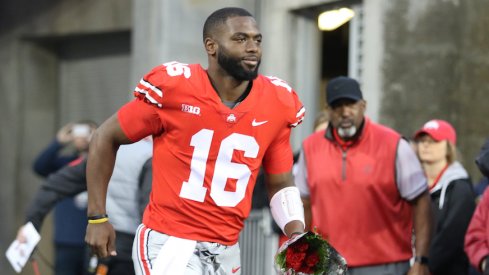 J.T. Barrett takes the field before his final game at Ohio Stadium.