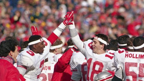 Ohio State players celebrated after wearing "Earle" headbands and beating Michigan in Earle Bruce's final game in 1987. (Robert Kozloff, Associated Press)