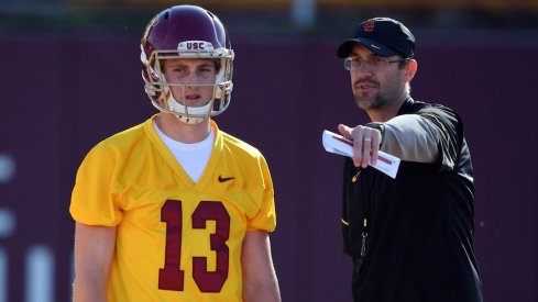 Former USC quarterbacks coach Tyson Helton coaches Trojans backup quarterback Jack Sears prior to the season.