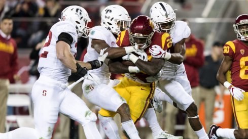 Dec 1, 2017; Santa Clara, CA, USA; USC Trojans running back Ronald Jones II (25) is tackled by the Stanford Cardinal in the second quarter of the Pac-12 Conference championship game at Levi's Stadium. Mandatory Credit: John Hefti-USA TODAY Sports