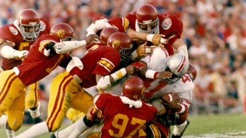 Keith Byars gang-tackled by USC in the 1985 Rose Bowl. (Inside USC)