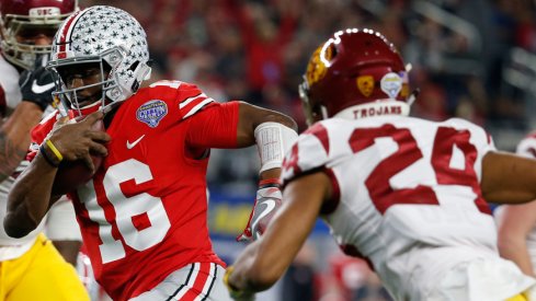 J.T. Barrett runs against USC.