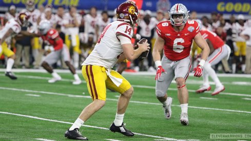 Sam Hubbard encroaches on Sam Darnold.