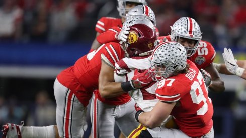 The Ohio State defense wraps up USC running back Ronald Jones in the 2017 Cotton Bowl.