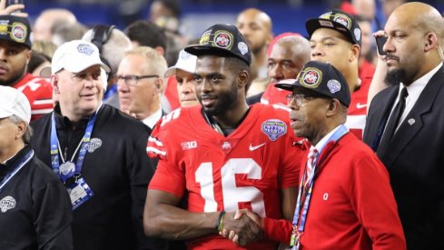 Ohio State quarterback J.T. Barrett and Ohio State president Michael Drake