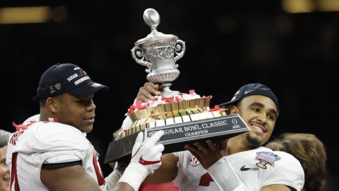 Alabama's Da'Ron Payne and Jalen Hurst celebrate after defeating Clemson in the College Football Playoff semifinal at the Sugar Bowl.