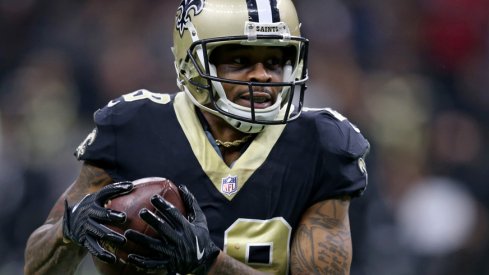 Ted Ginn sprints past defenders.