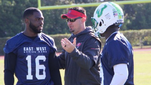 Zack Grossi (middle) coaches J.T. Barrett and USF quarterback Quinton Flowers at the East-West Shrine Game.