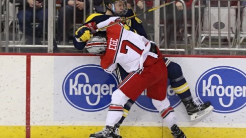 Buckeye defenseman Wyatt Ege tattoos a Michigan Wolverine.