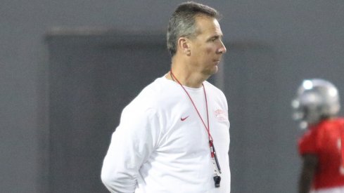 Urban Meyer watches closely during the first spring practice of the year.