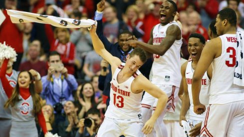 Feb 20, 2018; Columbus, OH, USA; Ohio State Buckeyes guard Andrew Dakich (13) and guard C.J. Jackson (3) and guard Kam Williams (15) celebrate as time winds down against the Rutgers Scarlet Knights at Value City Arena. Mandatory Credit: Joe Maiorana-USA TODAY Sports