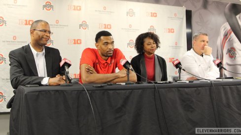 Keita Bates-Diop, flanked by his parents Richard and Wilma, and Chris Holtmann