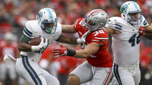 Tuf Borland attempts to make a tackle against Tulane.