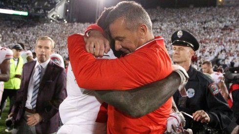 Urban Meyer hugs Parris Campbell following Ohio State's win in Happy Valley.
