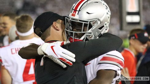 Brian Hartlin and Bin Victor embrace after Ohio State's comeback win over Penn State.