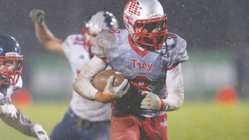 Troy running back Jayden Culp Bishop gets away from Piqua defenders