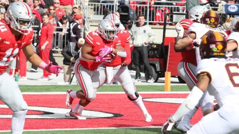 J.K. Dobbins running the ball against Minnesota.