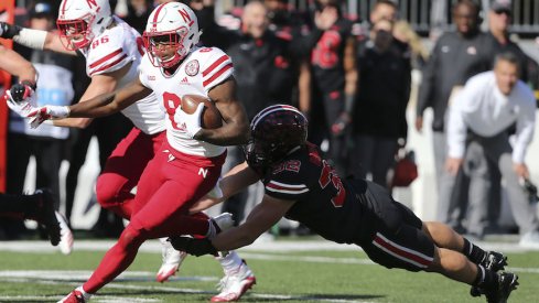 Tuf Borland makes a tackle as Stanley Morgan Jr. tries to get away from him in Saturday's game.