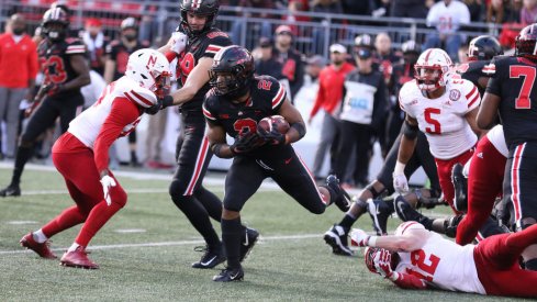 J.K. Dobbins squares up against an Nebraska defender. 