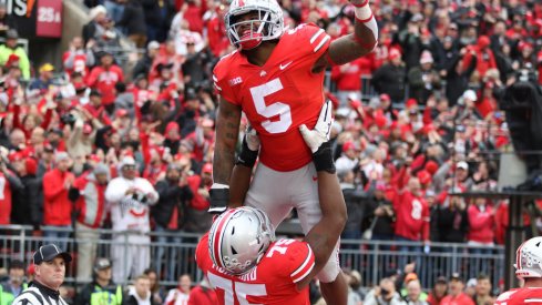 Mike Weber celebrates with Thayer Munford