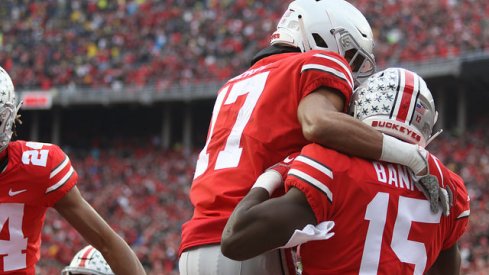 Chris Olave and Sevyn Banks celebrate teaming up for a blocked punt for a touchdown in the win over Michigan.