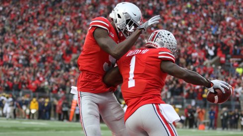 Victor and Dixon celebrate after a touchdown