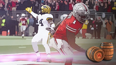 Nov 24, 2018; Columbus, OH, USA; Ohio State Buckeyes wide receiver Johnnie Dixon (1) scores a touchdown as Michigan Wolverines defensive back Josh Metellus (14) gestures to the officials at Ohio Stadium. Mandatory Credit: Greg Bartram-USA TODAY Sports