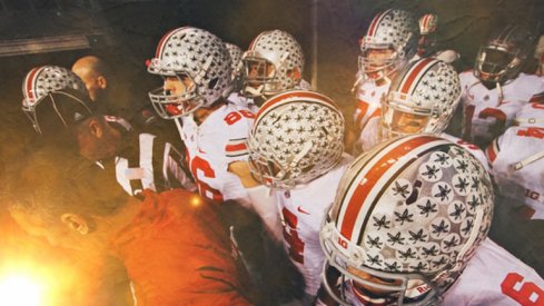 urban meyer leads the buckeyes onto the field for the 2013 B1G championship game