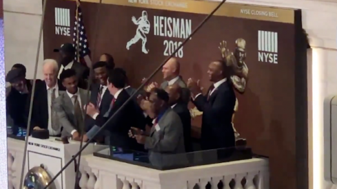 Dwayne Haskins helps ring the bell at the New York stock exchange.
