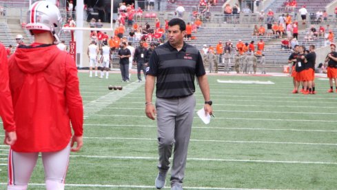 Ryan Day coaching quarterbacks during pregame warmups.