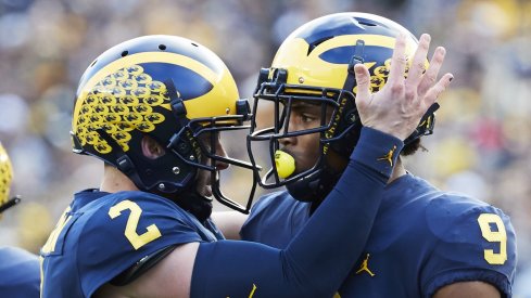 Nov 3, 2018; Ann Arbor, MI, USA; Michigan Wolverines wide receiver Donovan Peoples-Jones (9) receives congratulations from quarterback Shea Patterson (2) after he scores a touchdown in the first half against the Penn State Nittany Lions at Michigan Stadium. Mandatory Credit: Rick Osentoski-USA TODAY Sports