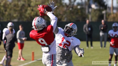 Binjimen Victor catches a touchdown pass over Sevyn Banks